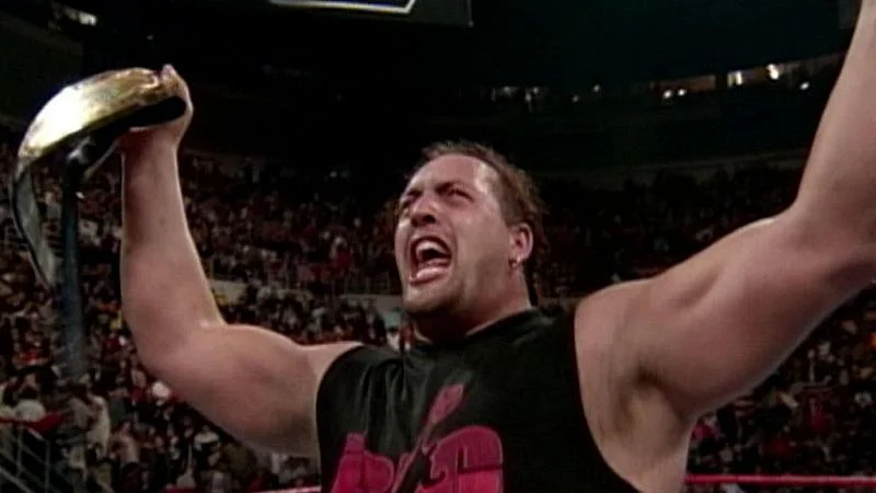 Big Show reacts emotionally as he holds up his newly-won WWF championship.