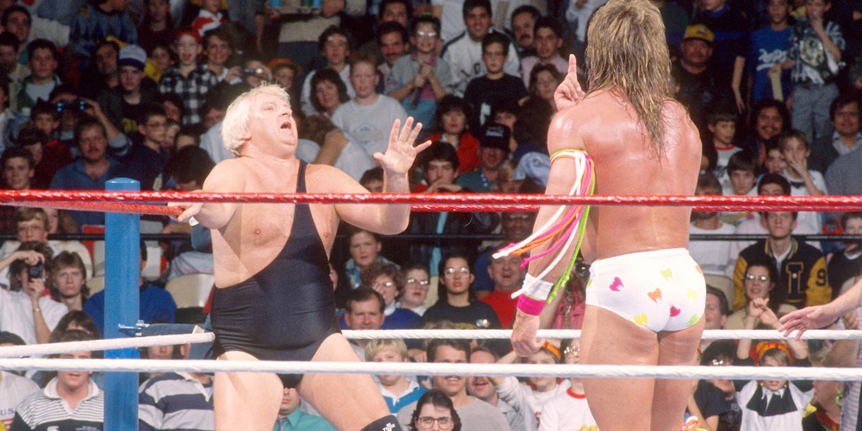 The Ultimate Warrior sizes up Bobby Heenan as the cowardly manager begs in the corner.
