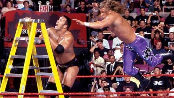 Triple H dives to block The Rock's attempt to retain the IC belt at SummerSlam.
