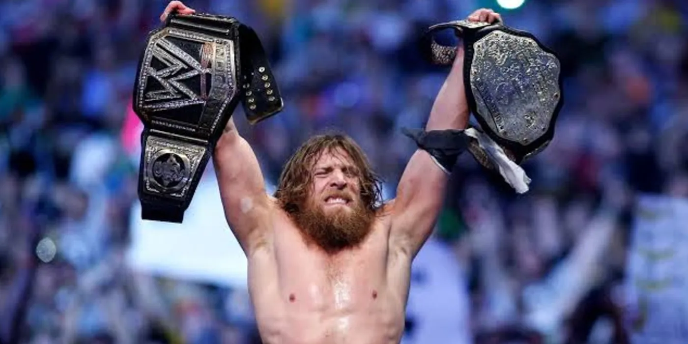Daniel Bryan triumphantly raising both world title at WrestleMania XXX.