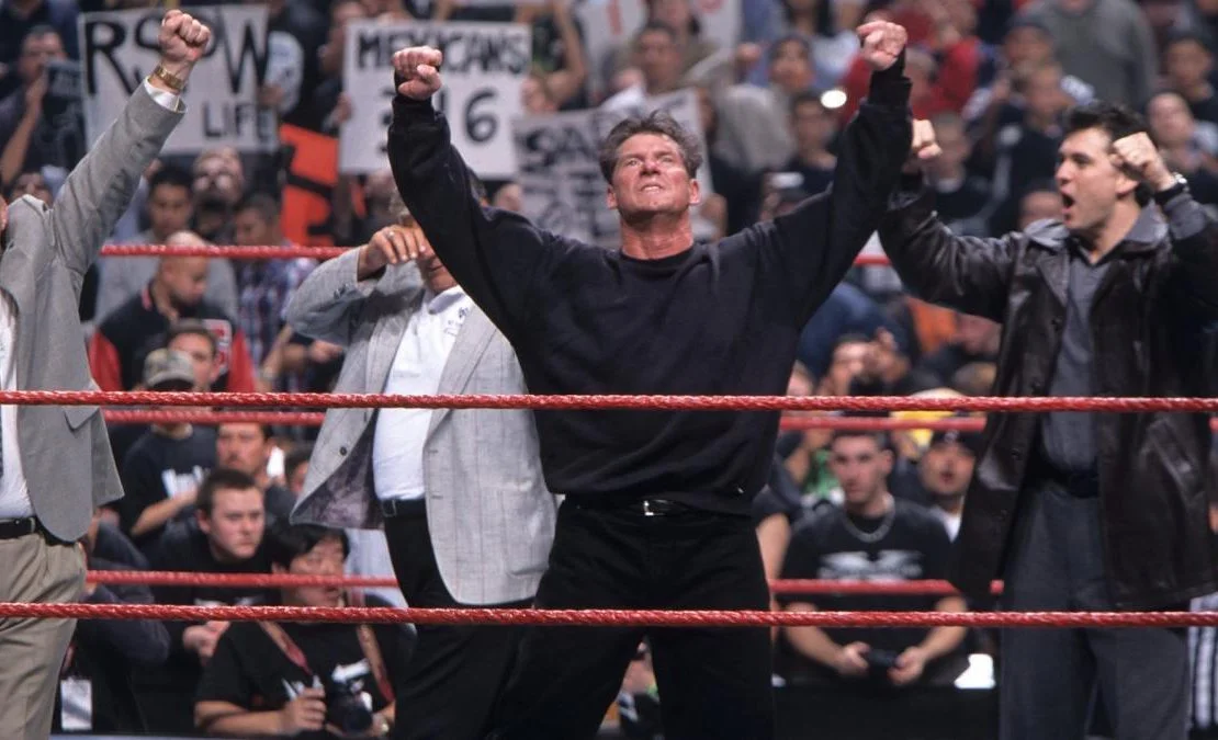 Vince McMahon raises his arms after winning the Royal Rumble.