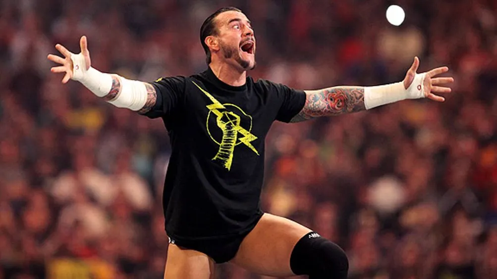 CM Punk poses on the top rope.