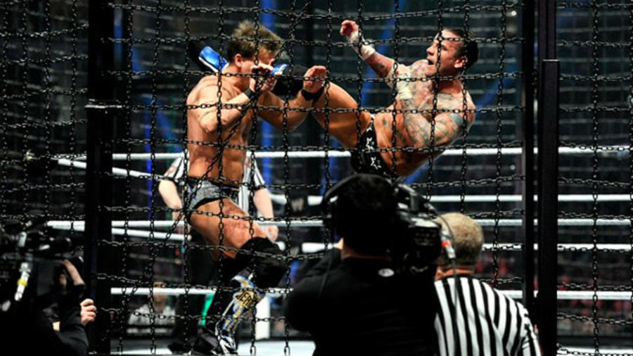 CM Punk gives a roundhouse kick to Chris Jericho.