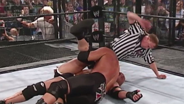 Triple H pins an unconscious Goldberg.