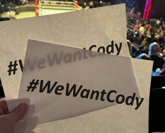 WWE Distributes #WeWantCody Signs to Fans at RAW